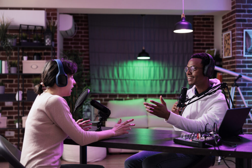 Diverse team of people working in studio to record podcast
